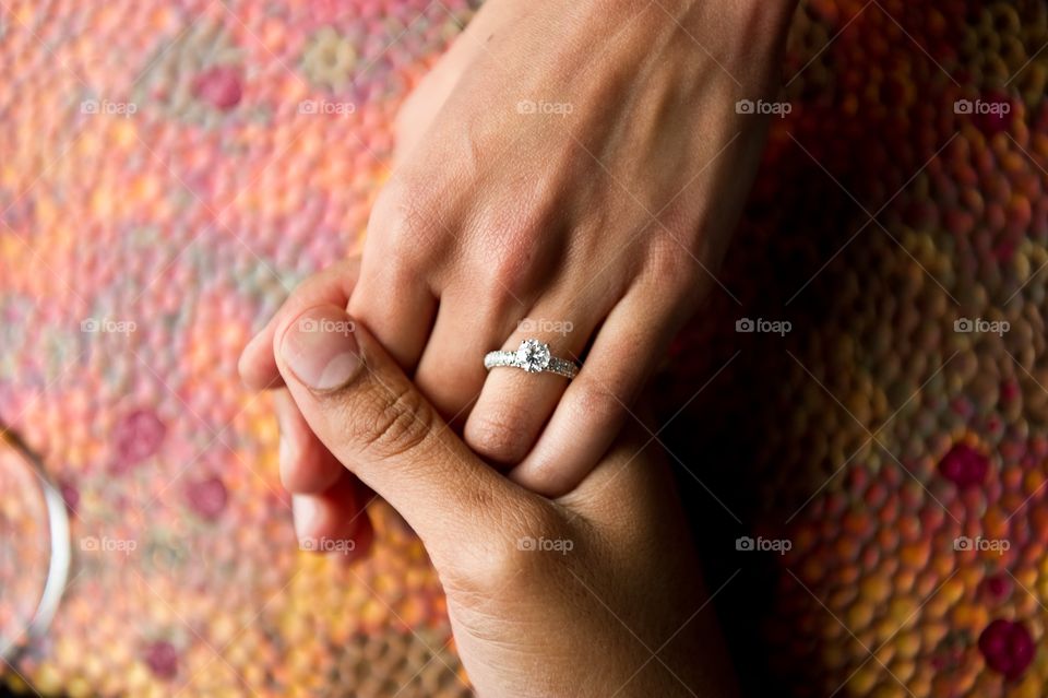 Holding hands from above