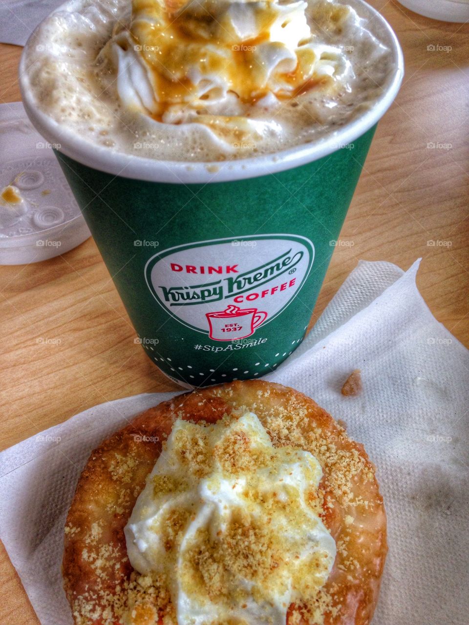 Breakfast of champions. Krispy Kreme doughnut and caramel latte 