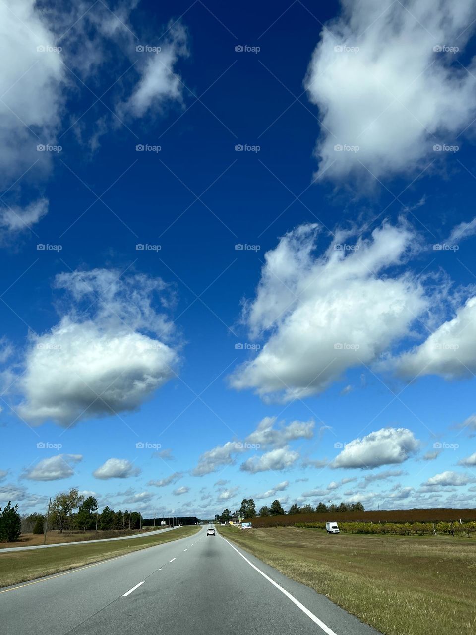 Tidy Clouds over road 