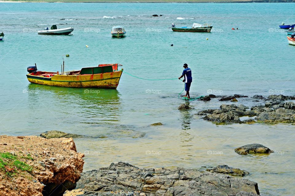 fisherman getting his boat, boa vista cape verde