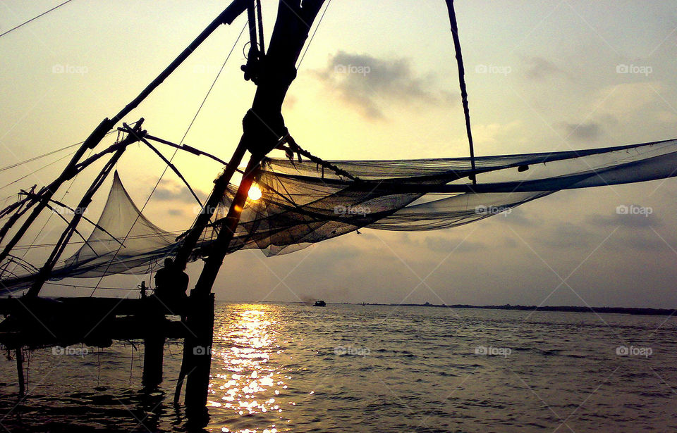 Sun set at fortkochi  beach. with fishing net