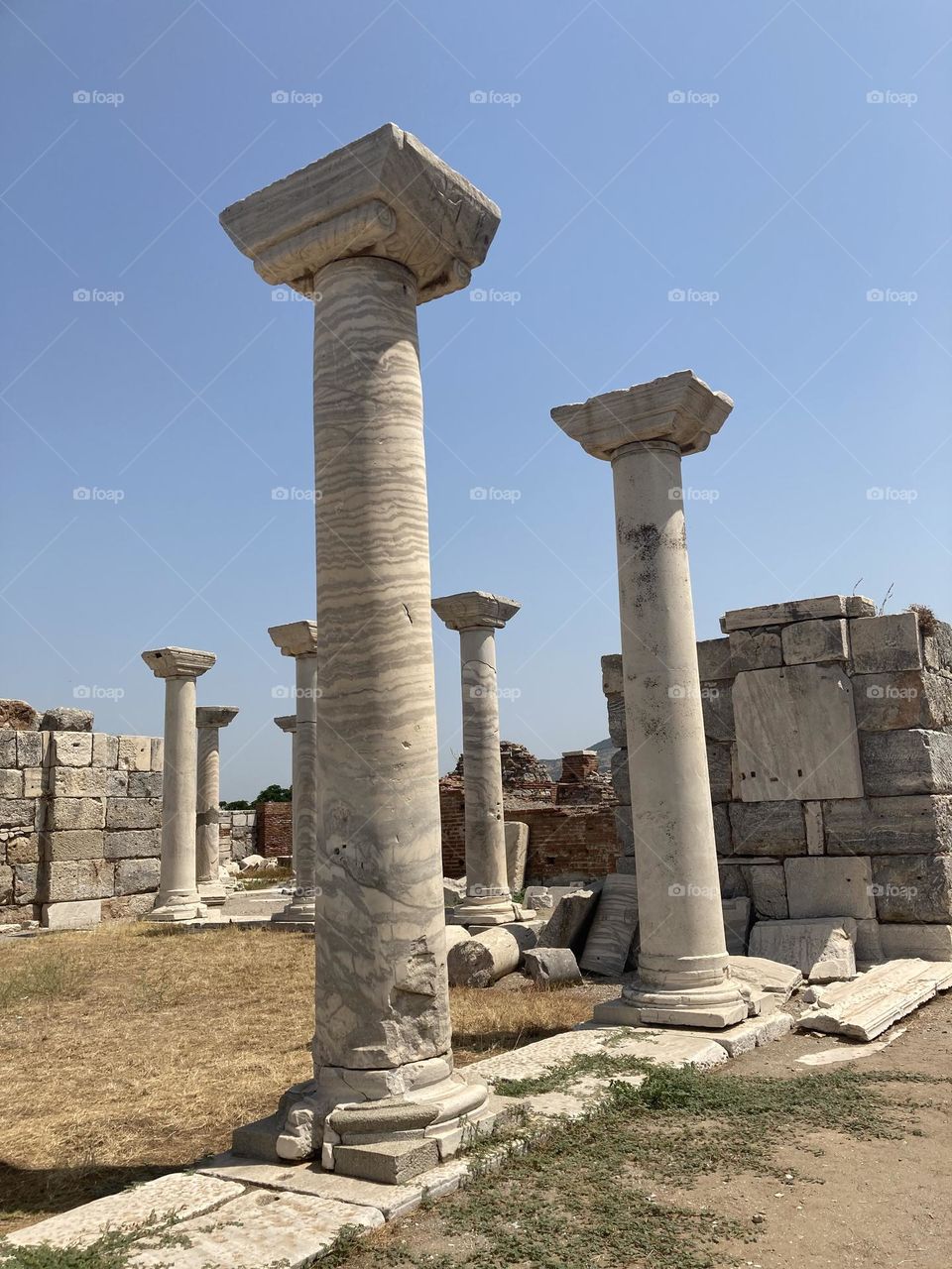 Ancient ruins Sunny holidays I’m Turkey. Walk in the cute city and charming streets by the beach in Kusadasi. perfect blue sky and ocean view. Beach and the shore. To travel is to live. Gorgeous tall palm trees.