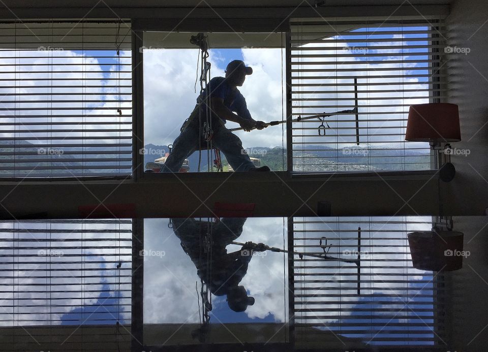 Window washer in high-rise building 