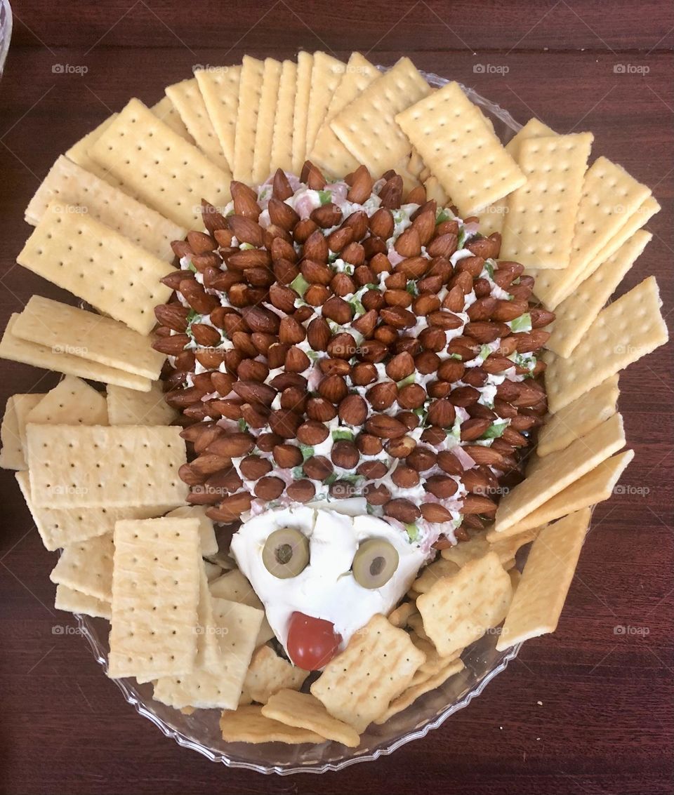 Food Art.  Cheese ball With Almonds  made to look like a hedgehog. 