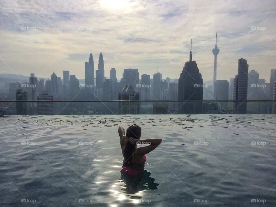 Young woman enjoying the city view in Kuala Lumpur