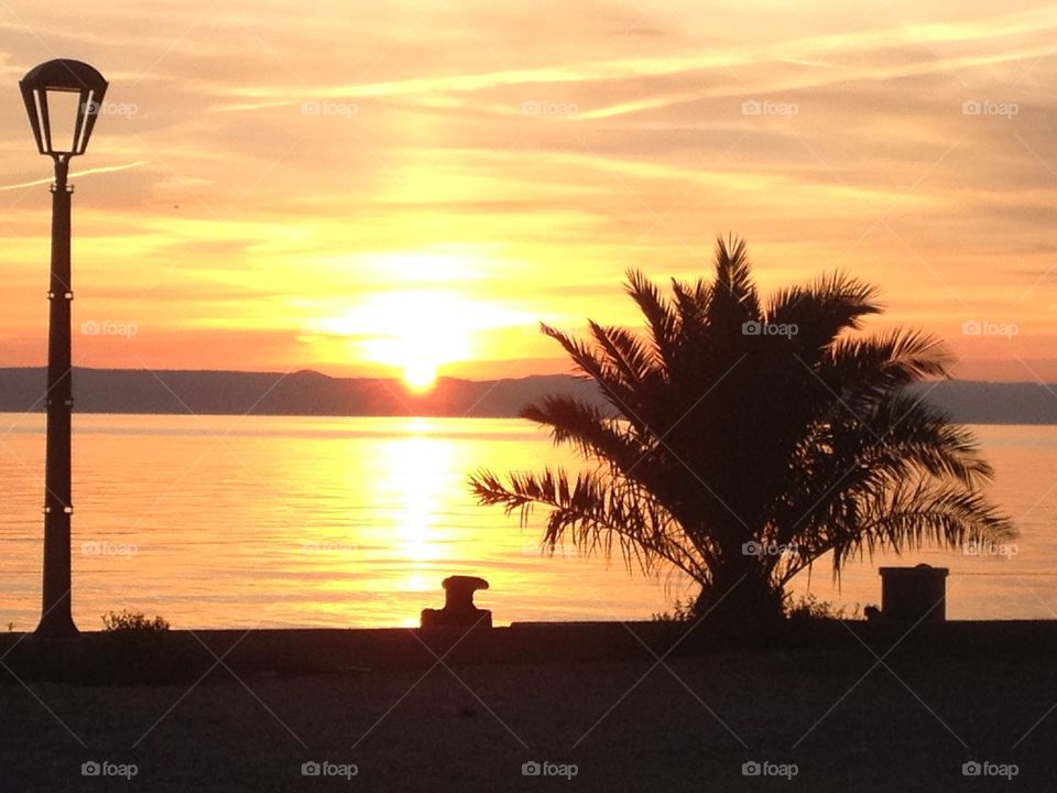 Golden hour. Sunset behind the island hvar