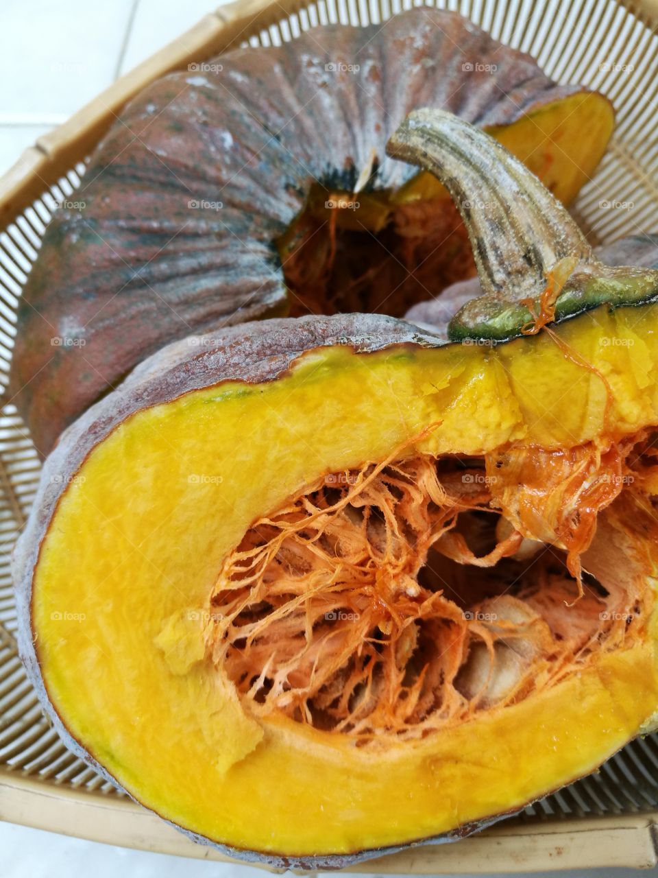 Closeup of pieces of pumpkin in a basket.