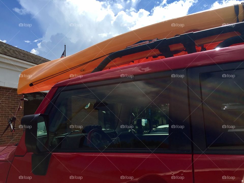 Red keep with a yellow kayak or canoe 