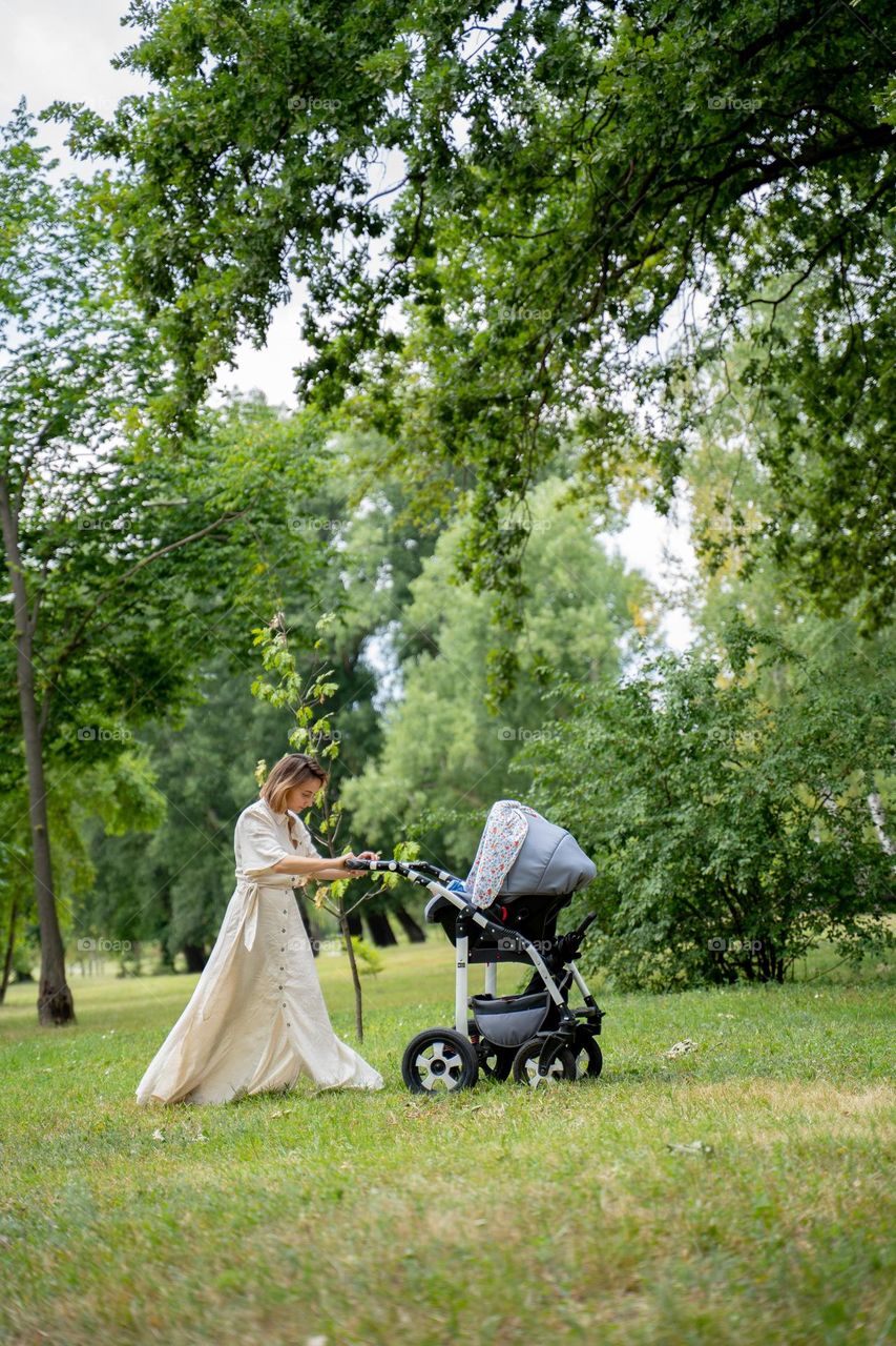 Summer! A nurturing mother walks through a serene forest 🌳