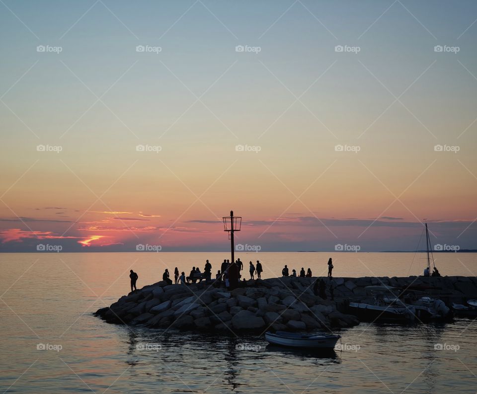 Tourists admiring a breathtaking sunset.