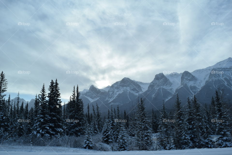 Sunrises behind mountains at winter