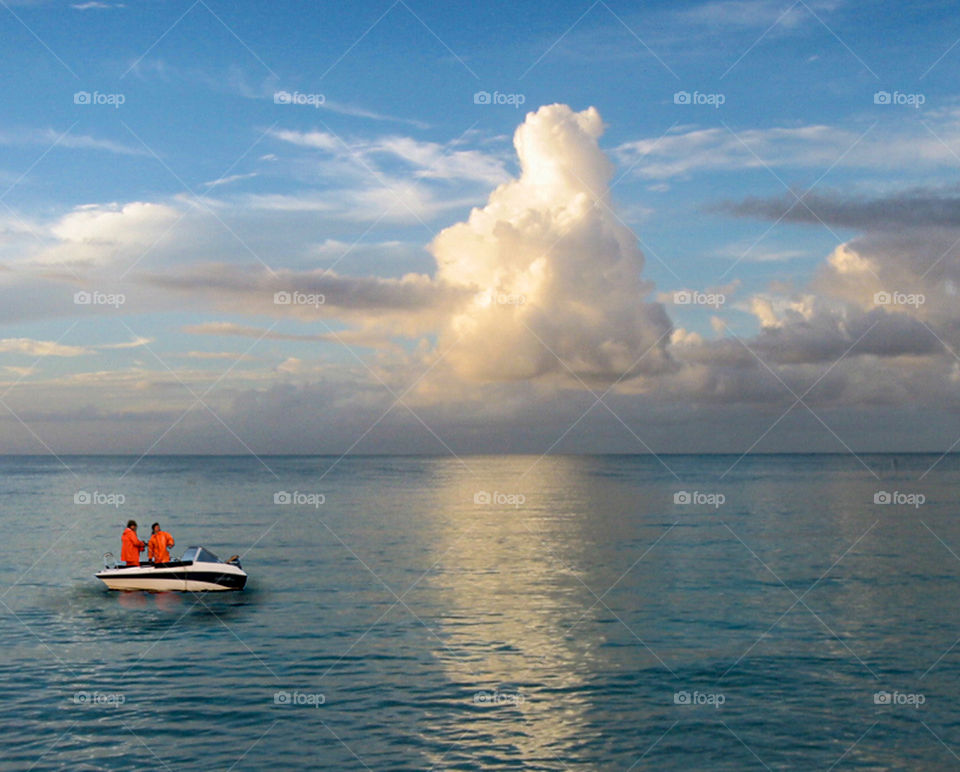 Two men in a boat. 