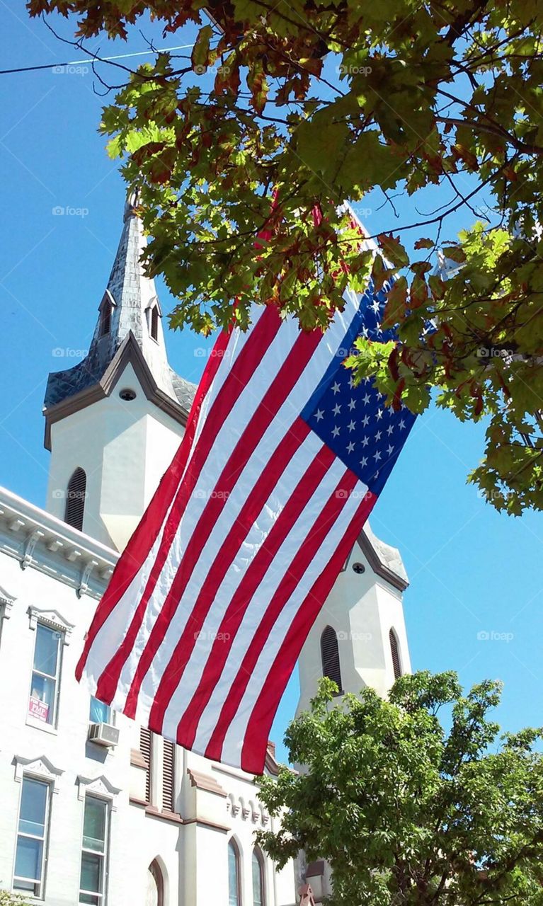 American flag flying outside of a historic church in Frederick, MD