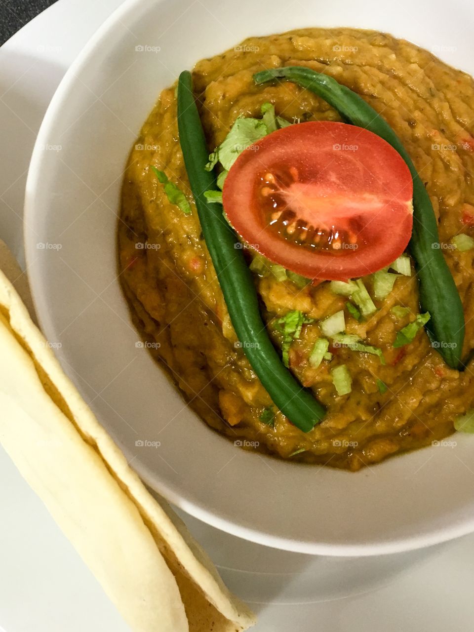 Homemade pumpkin squash lentil vegetable soup vegetarian food 