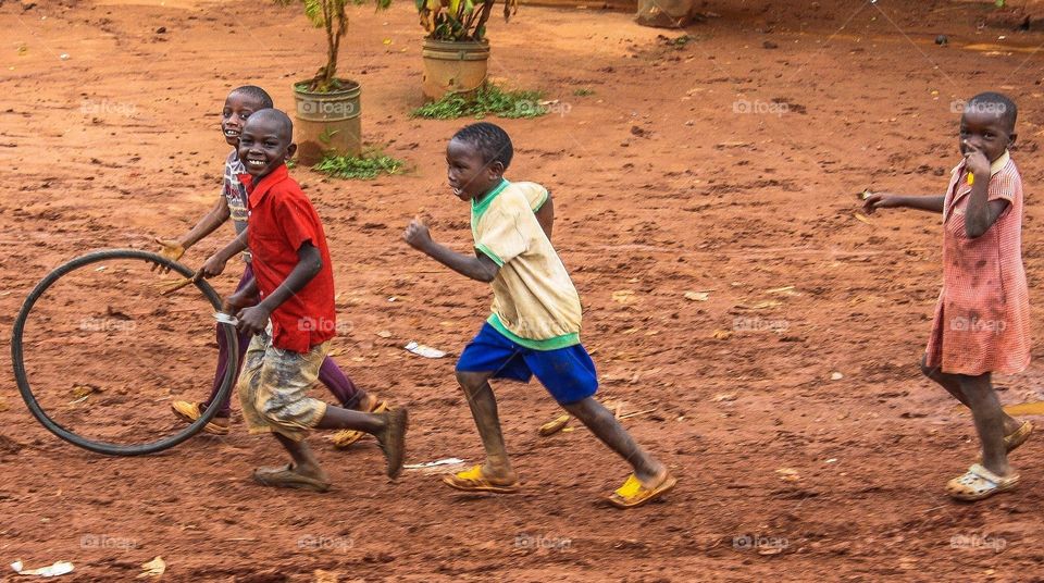 Playing. I was driving through Tanzania when these children started chasing the car.