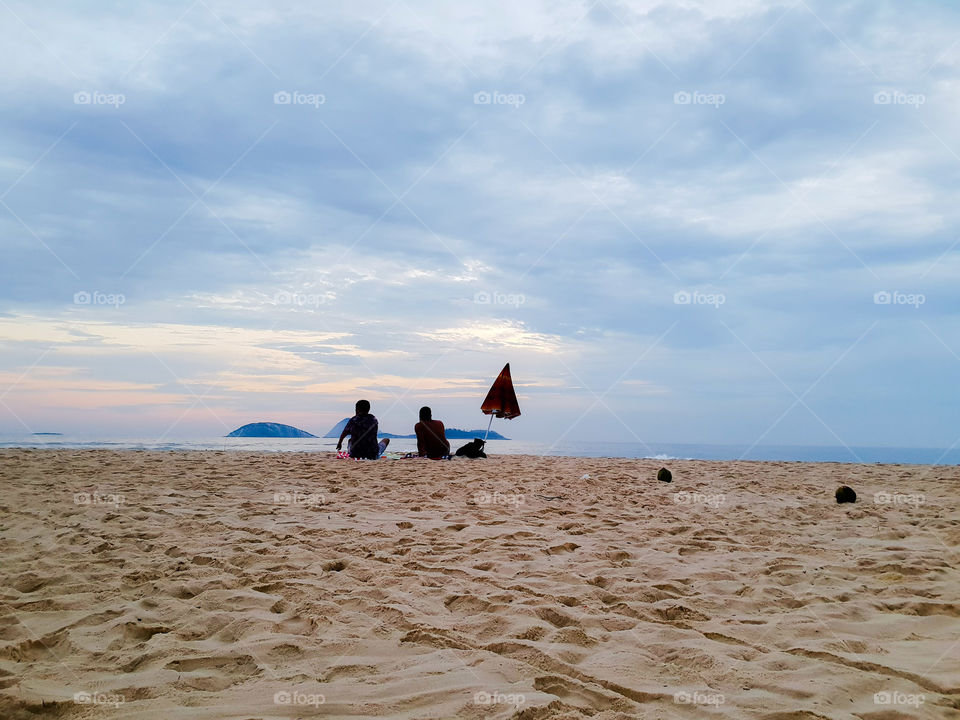 Two people on the Ipanema beach