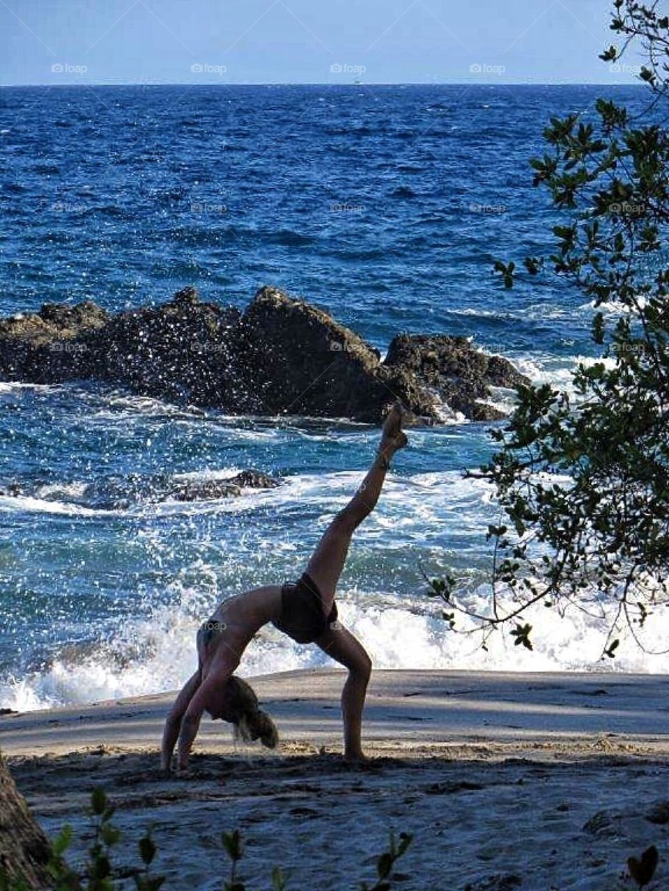 Joga exercise on the beach