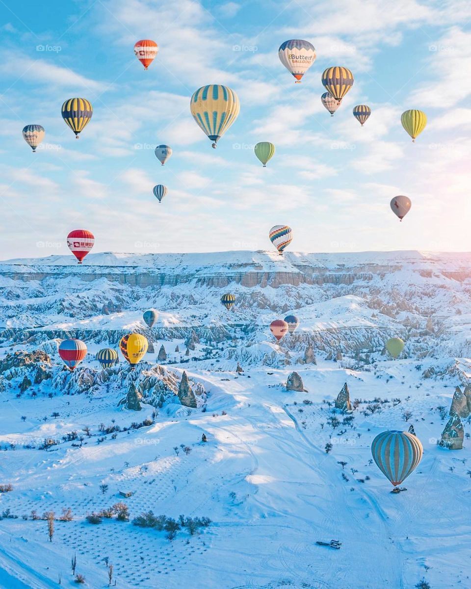 Magical hot air balloon rides over a snowy landscape ❄️ #Cappadocia Turkey 🇹🇷