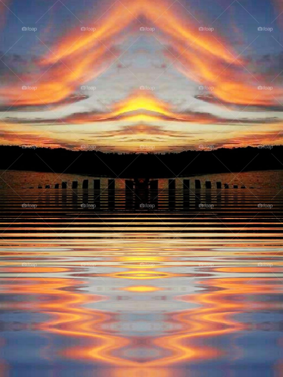 mirrored and rippled sunset over salt marsh