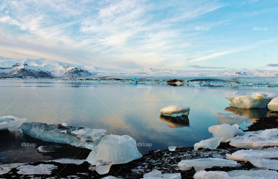 glacier lagoon in Iceland. giant blocks of ice crystal floating on lake mirror