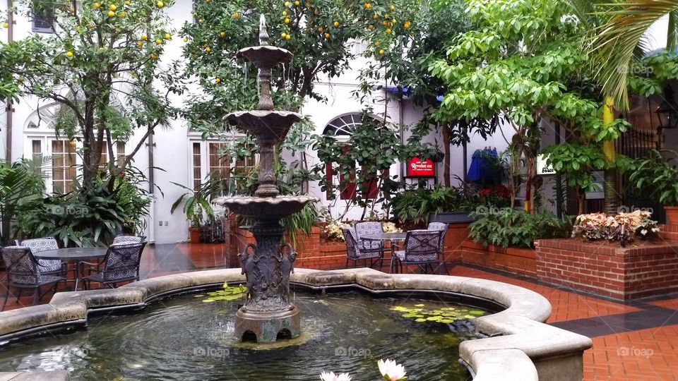 Courtyard fountain and cafe at New Orleans hotel