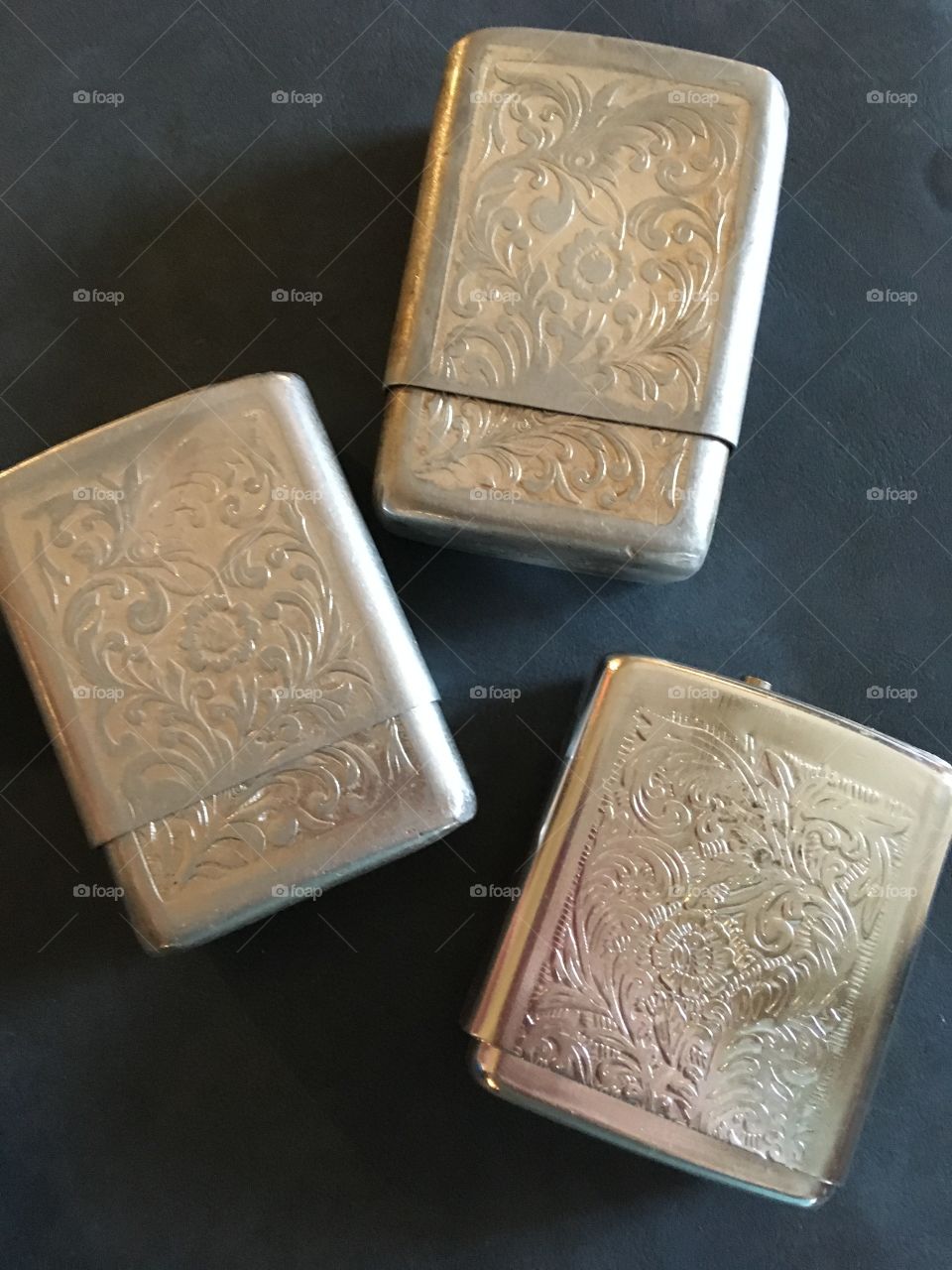 A small collection of Silvertone vintage cigarette pack holders. 