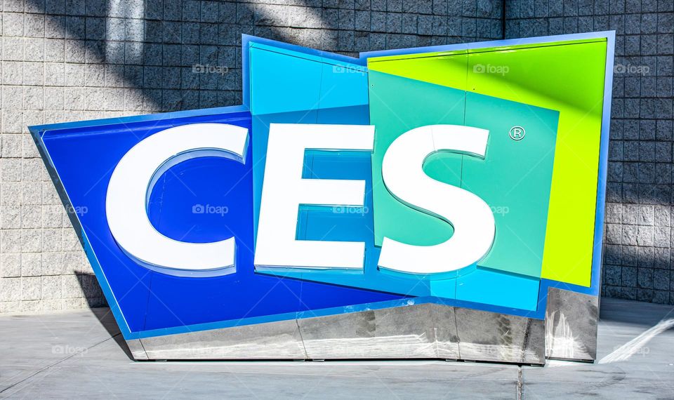 Las Vegas, NV 1-6-2023: Large logo of CES outside the entrance of LV Convention Center. Held annually, CES is the largest consumer electronics convention in the world. Vibrant cool colors on the sign.