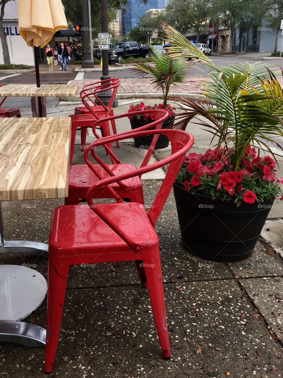 Sidewalk cafe with red chairs
