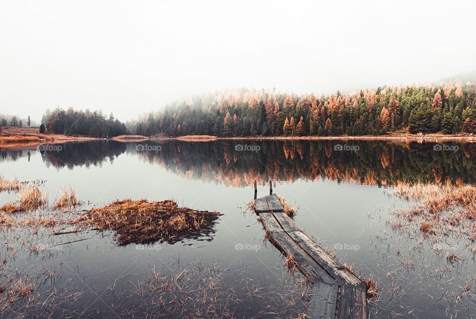 Besutiful lake in the autumn with colorful leaves