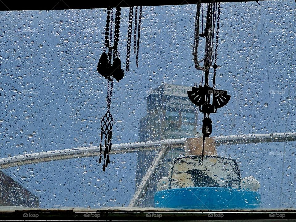 What appears like a glittering curtain is in fact raindrops on the window of our “28 ft 1969 Luhrs” cabin cruiser at “Newtown Creek” by the “Pulaski Bridge” in LIC, Queens. 2024. Hypnotic Productions