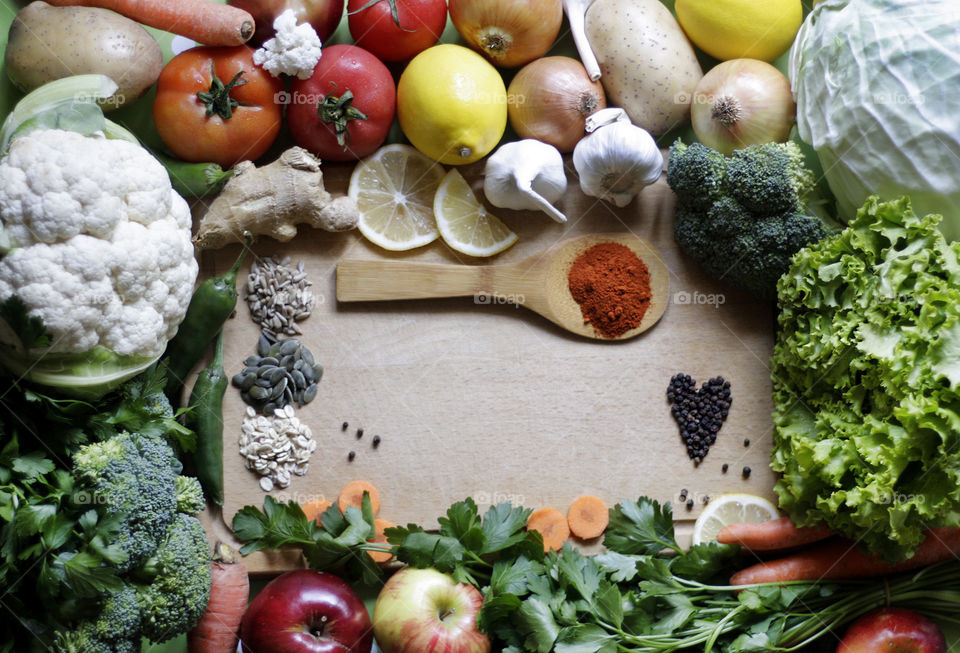 Fruits, vegetables, herbs, seeds and spices on the table