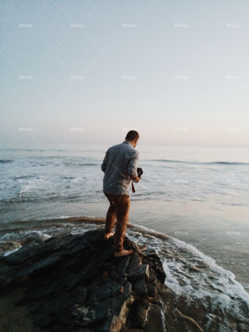 Standing in the ocean. 