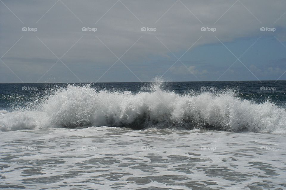 ocean sea wave impacting the shore