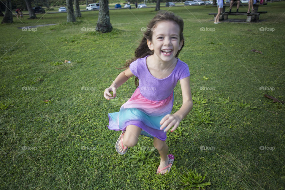 Girl running to the camera and laughing