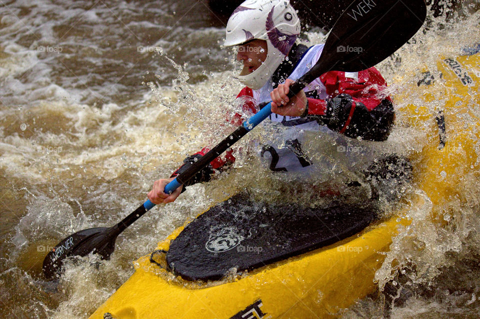 Helsinki, Finland - April 17, 2016: Unidentified racer at the annual iceBREAK whitewater kayaking competition at the Vanhankaupunginkoski rapids in Helsinki, Finland.