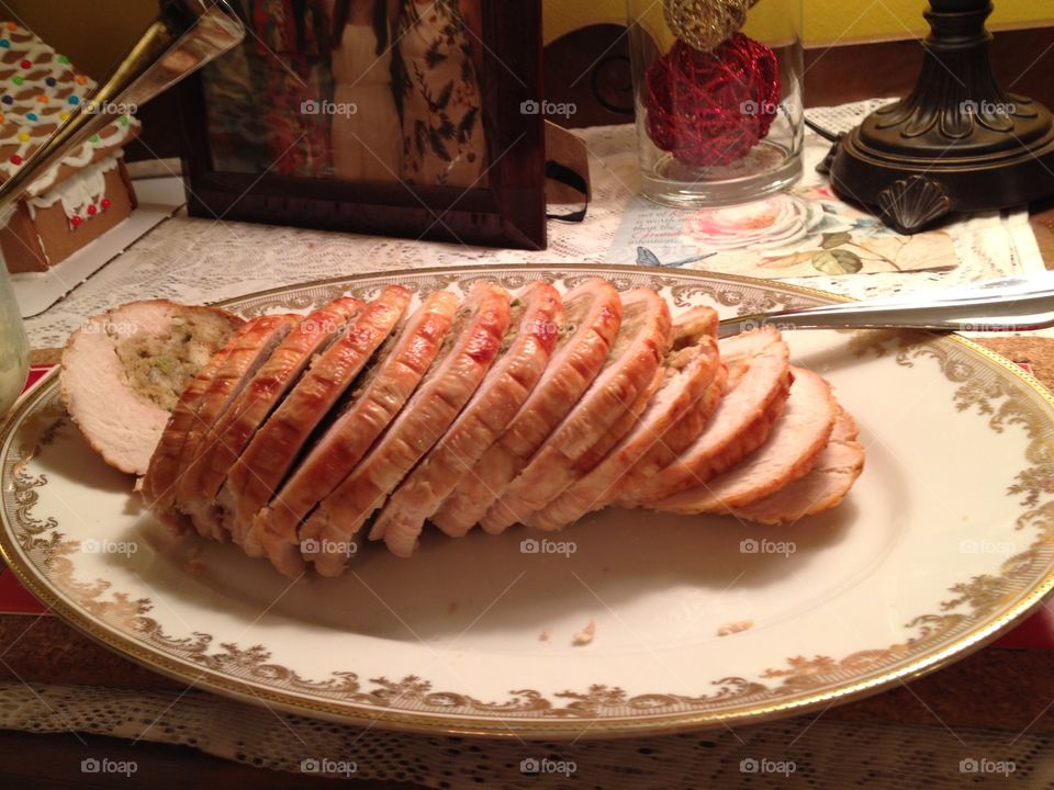Christmas Turkey. Plattered sliced stuffed turkey roll