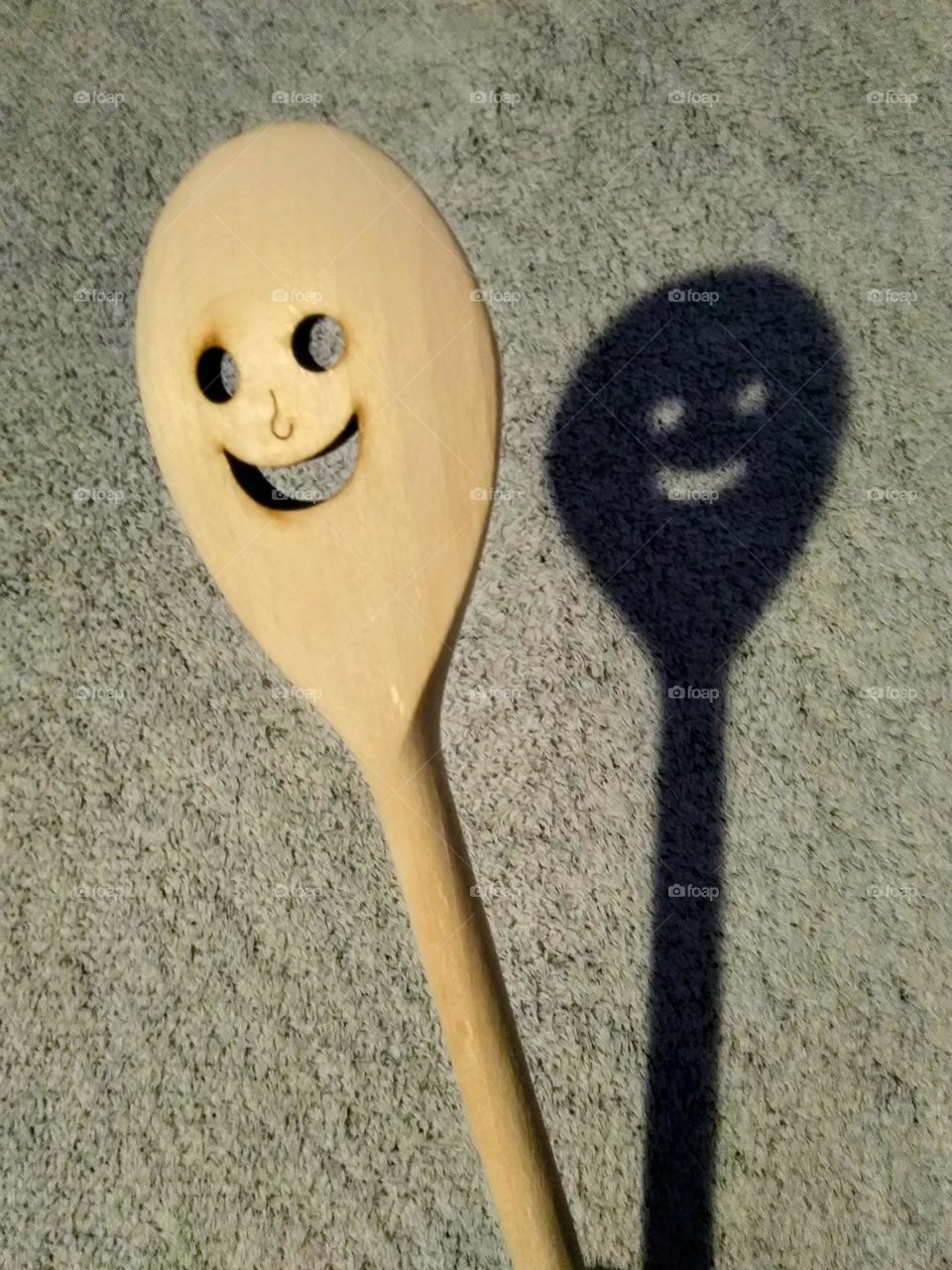 the smiling and shadowy spoon
