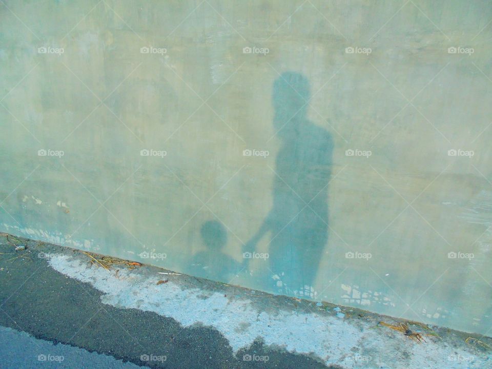 Shadow of father and son