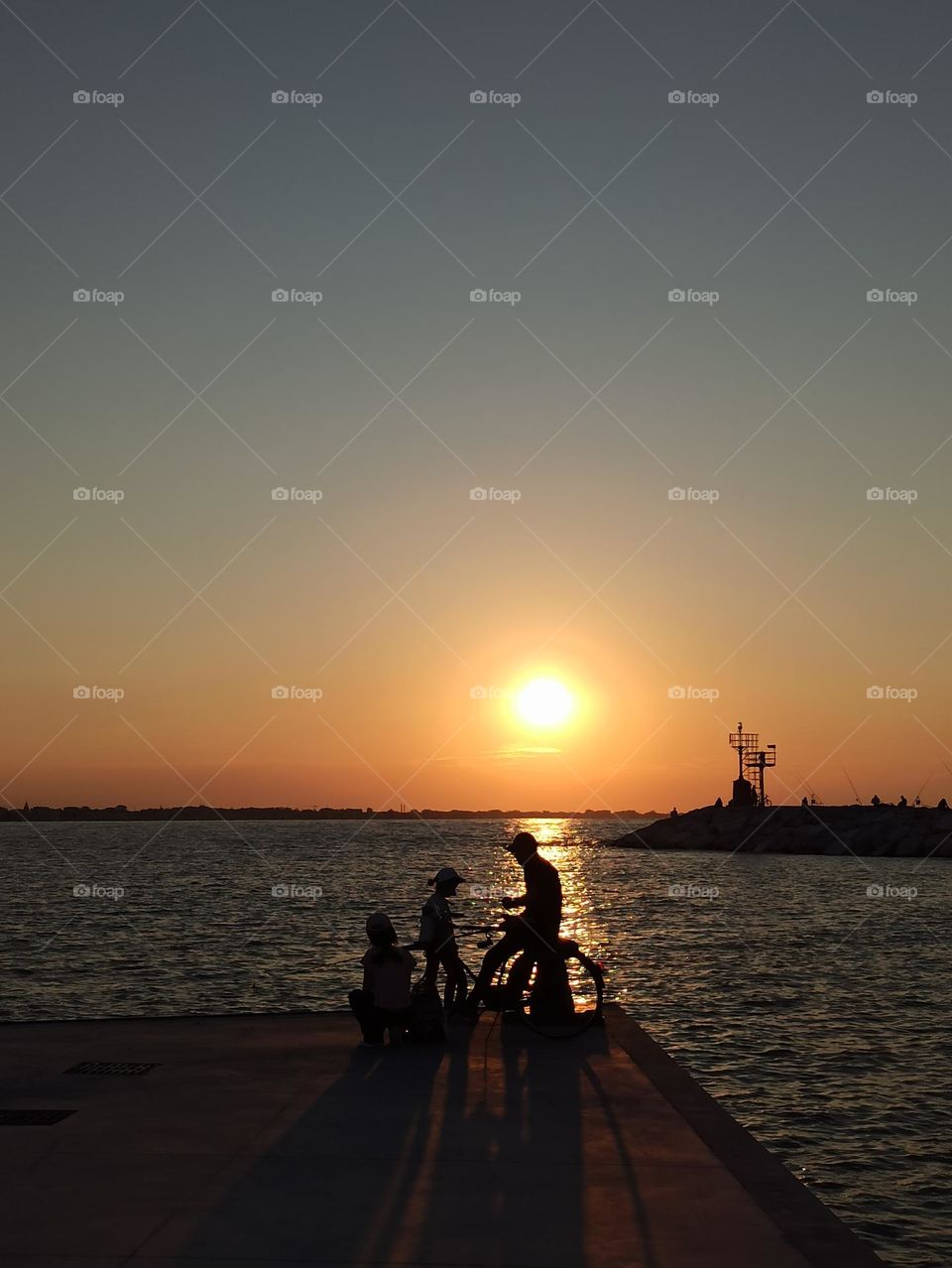 Glimmers: small moments of happiness . family at sunset