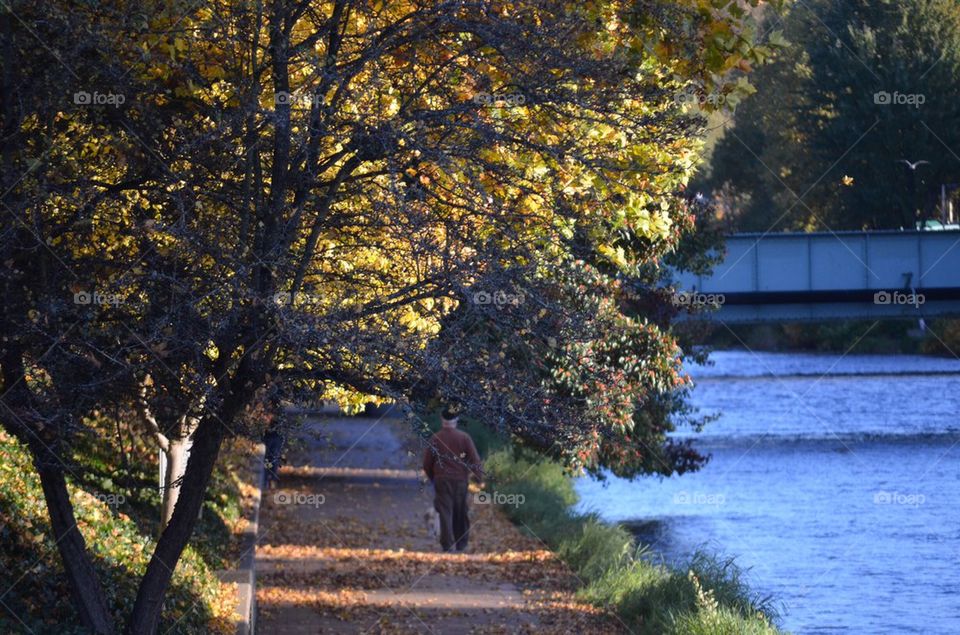 Man walking by the river