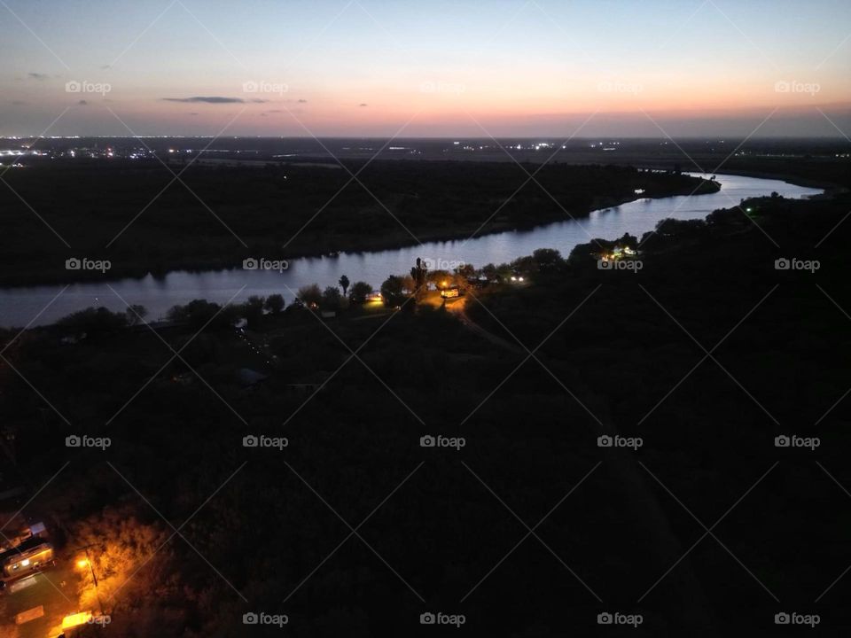 Sunset over a river drone picture