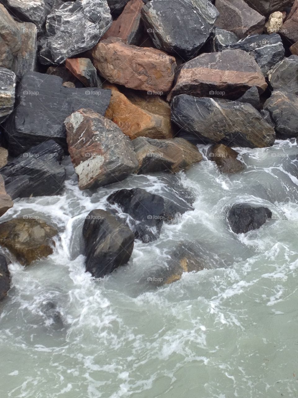 Water rolling over rocks. 
