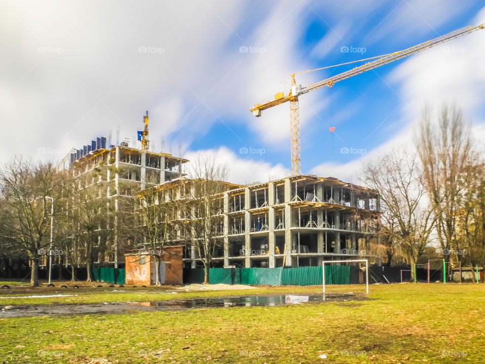 building process with crane on long exposure