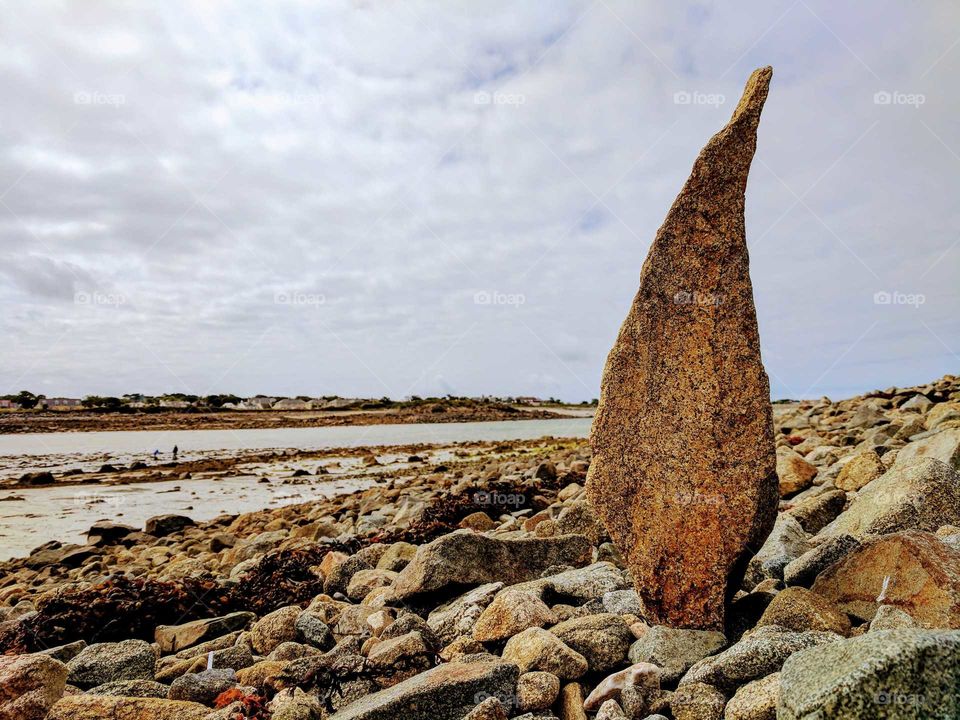 Stone shaped like a flame on an island beach
