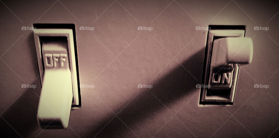 Off and On. Simple photo of light switches. 