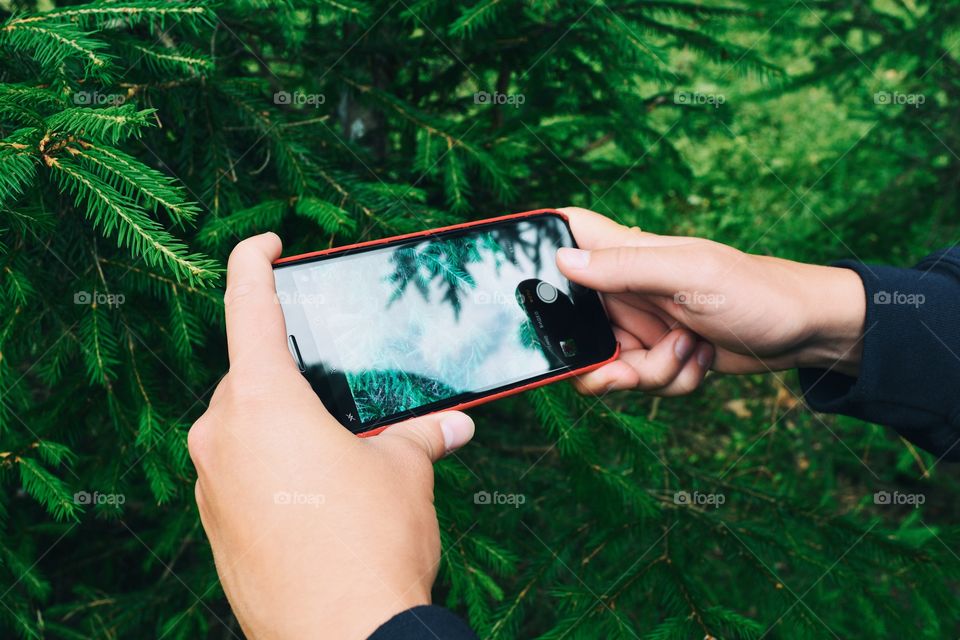 People snapping photo with smartphone 