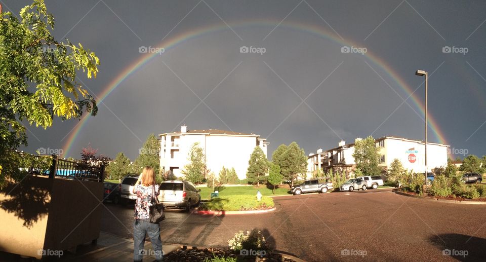 Full rainbow  in the dark sky