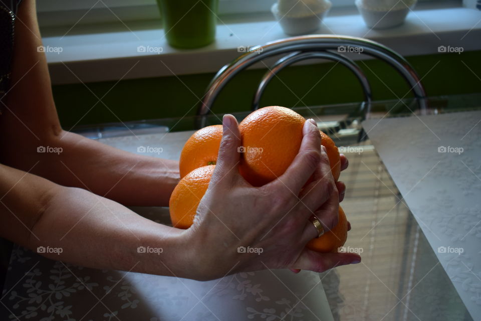 Orange , hand ,fruit