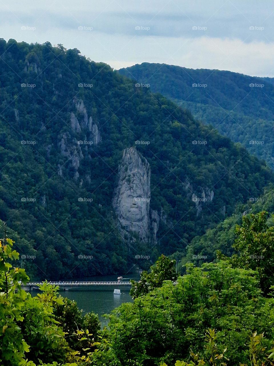 the sculpture of the face of the Decebal Dacian king, seen from the Serbian bank of the Danube