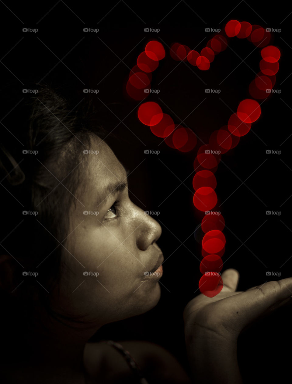 Love, heart shape lights. bokeh red heart on hand